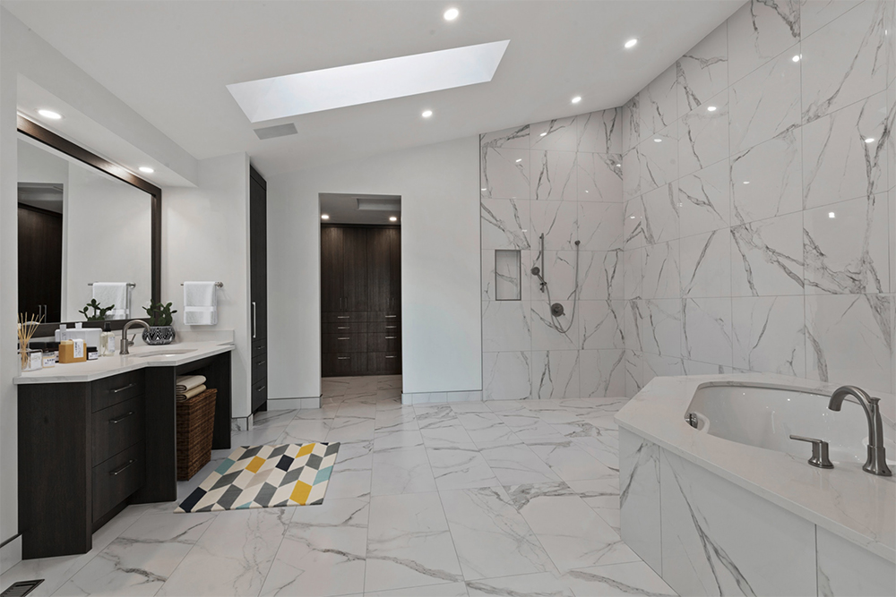 Calgary accessible bathroom renovation with curbless shower and safety grab bars